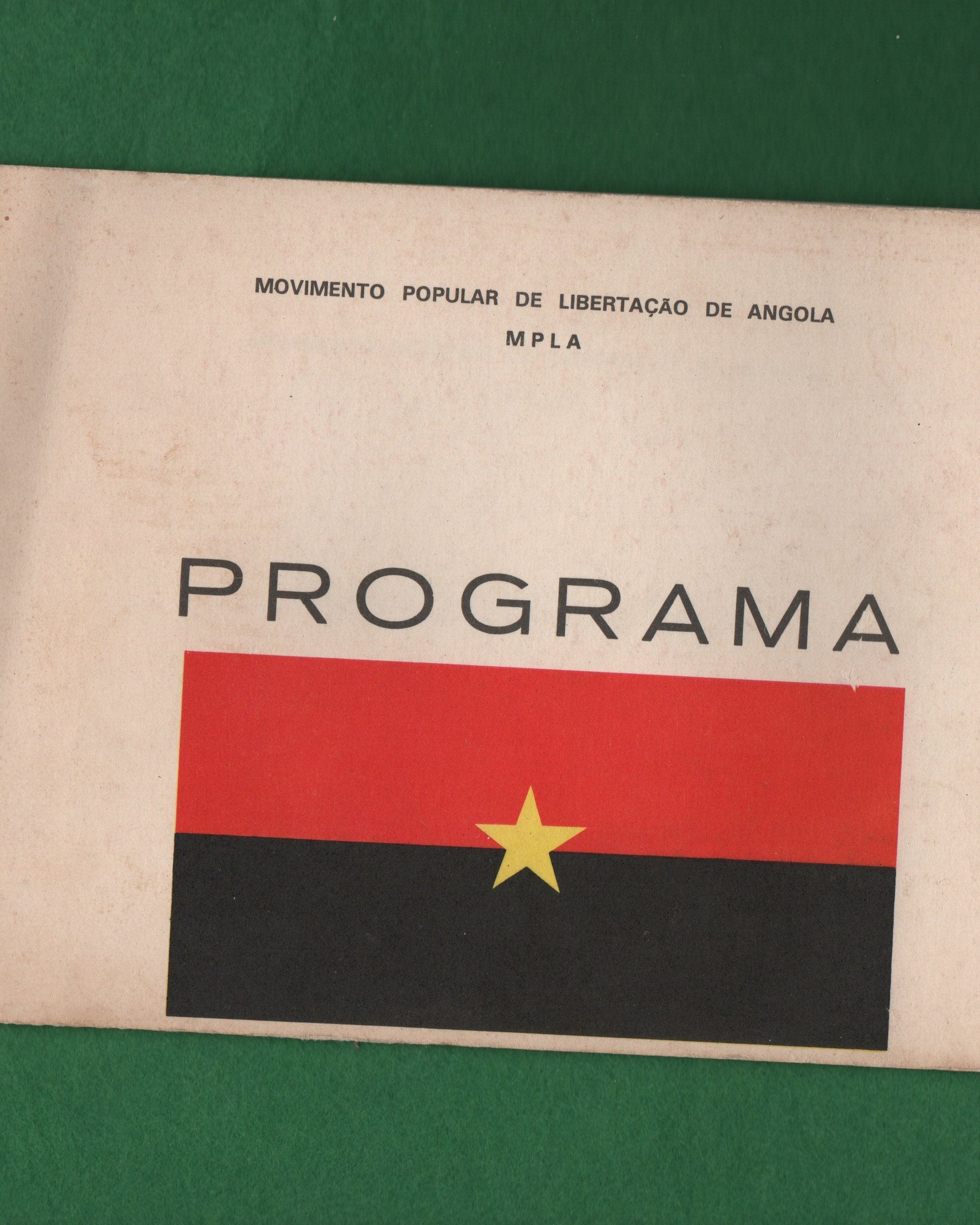 Program booklet with Angolan flag design on a green background